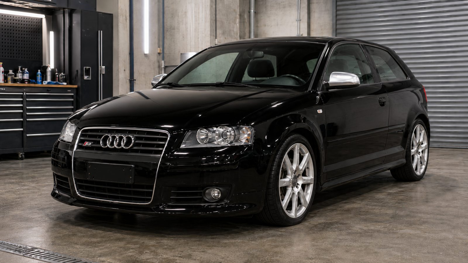 The same Audi S3 fully restored to gloss black after ARS bodywork and paint